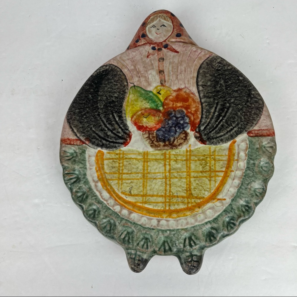 Hand-painted Italy woman with basket ceramic trivet/wall art by The Cellar